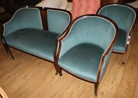 An Edwardian inlaid mahogany three piece boudoir settee
